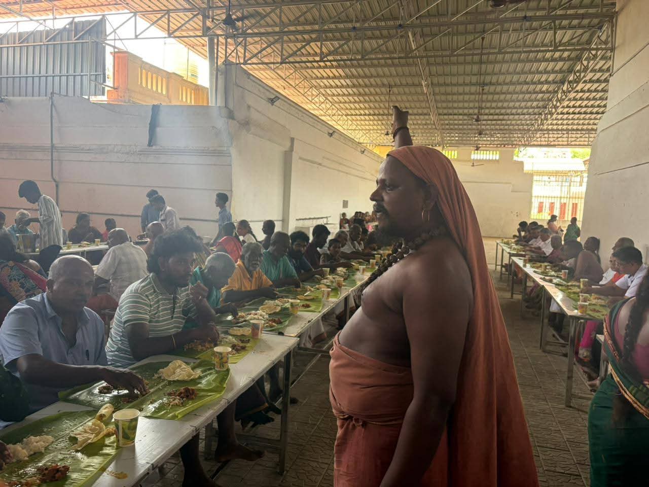 Saint overseeing bhandara feast