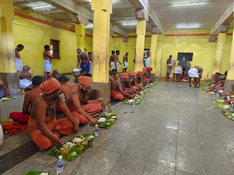 Devotees praying and sitting together
